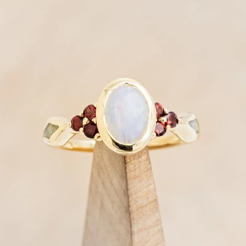 "AGATHA" - BEZEL SET OVAL CABOCHON CUT WHITE OPAL ENGAGEMENT RING WITH GARNET ACCENTS AND FIRE & ICE OPAL INLAYS