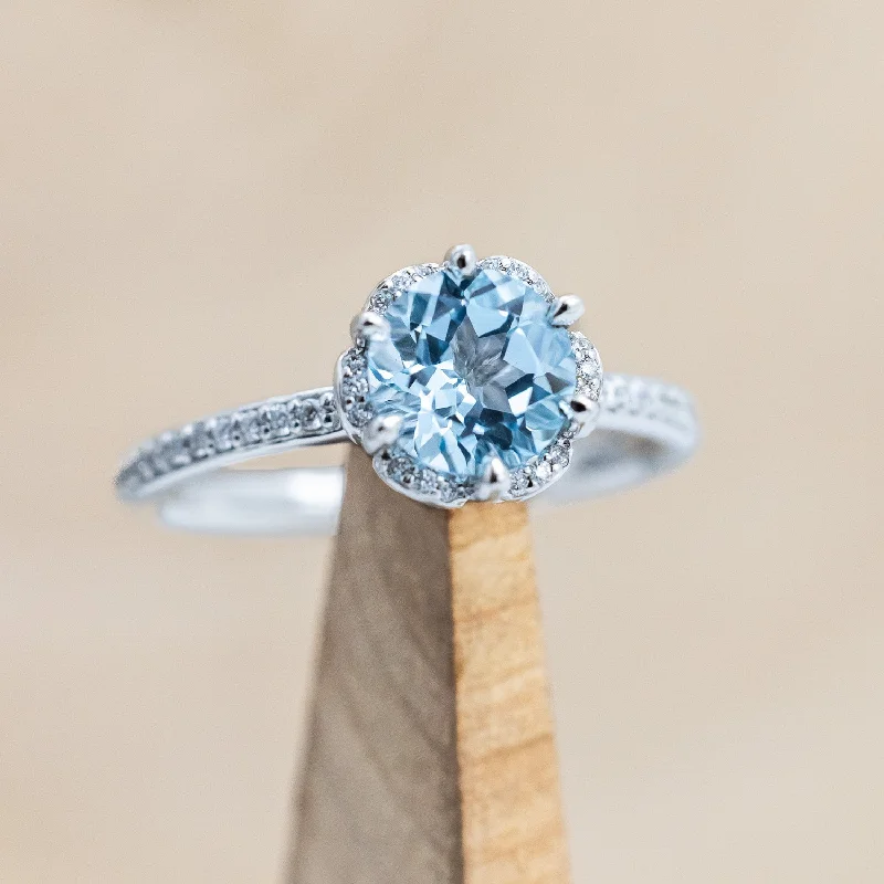 "ROSALIE" - ROUND CUT SKY BLUE TOPAZ ENGAGEMENT RING WITH DIAMOND HALO & ACCENTS