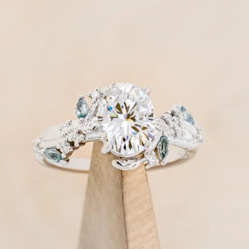 "PALLAS" - OVAL CUT MOISSANITE ENGAGEMENT RING WITH LEAF & GREEN TOURMALINE ACCENTS