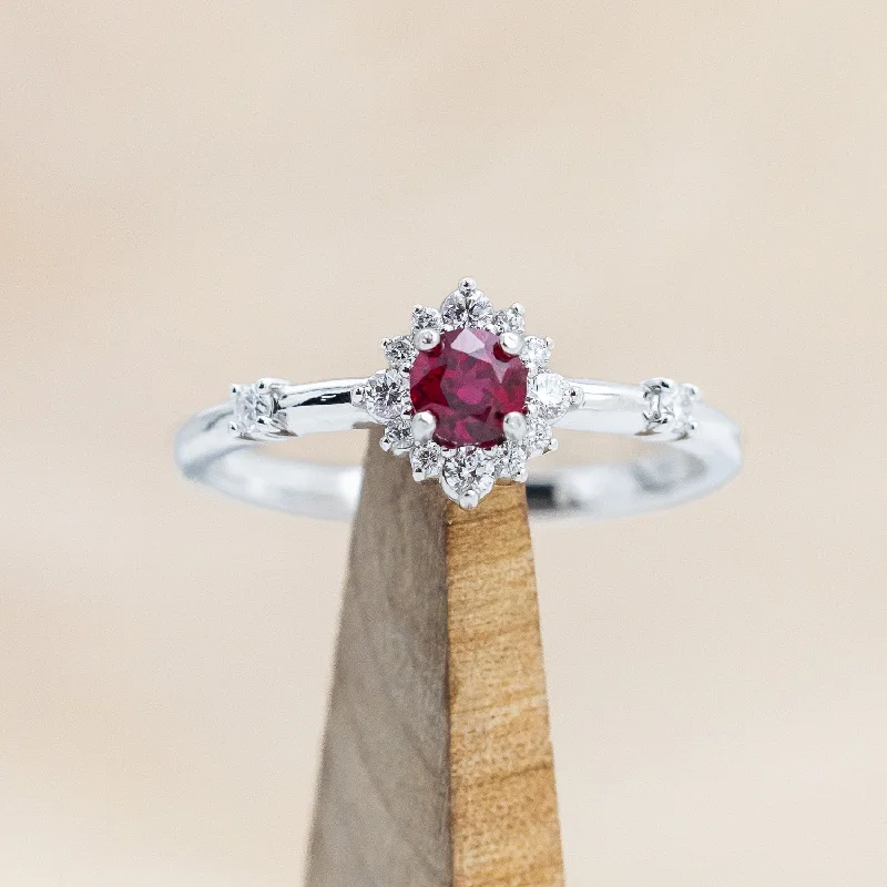 "STARLA" - ROUND CUT LAB-GROWN RUBY ENGAGEMENT RING WITH STARBURST DIAMOND HALO