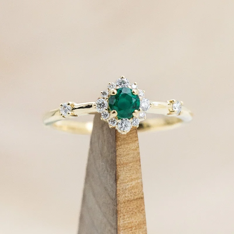 "STARLA" - ROUND CUT LAB-GROWN EMERALD ENGAGEMENT RING WITH STARBURST DIAMOND HALO