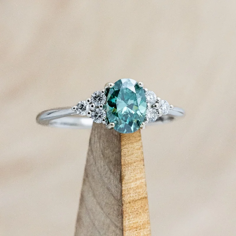 "RHEA" - OVAL CUT GREEN MOISSANITE ENGAGEMENT RING WITH DIAMOND ACCENTS